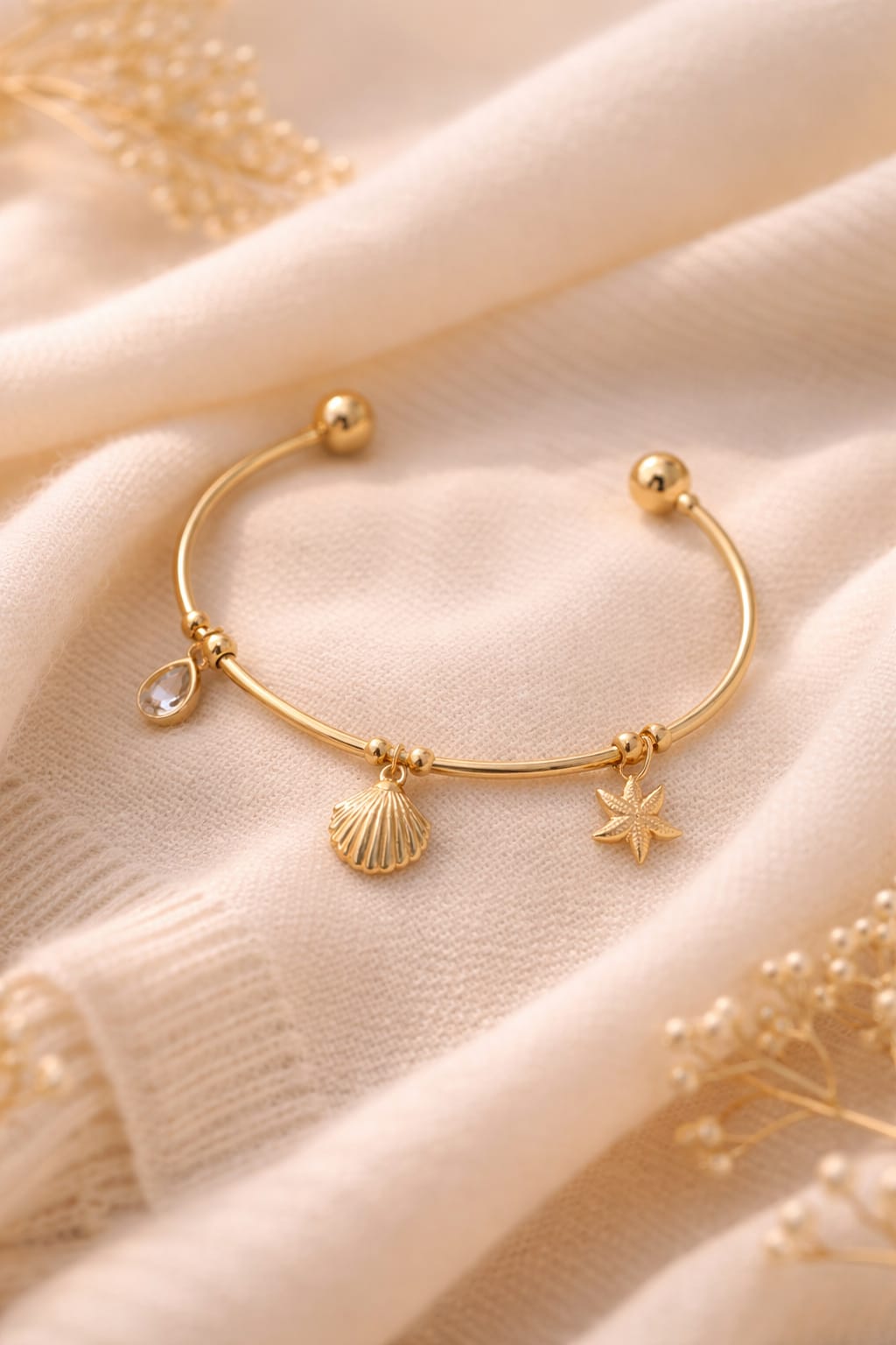 Ocean charm gold cuff bracelet