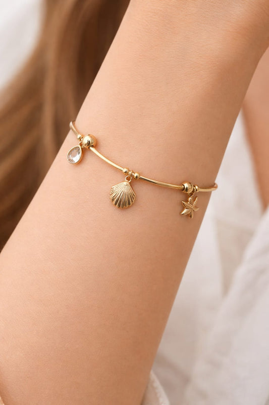 Ocean charm gold cuff bracelet